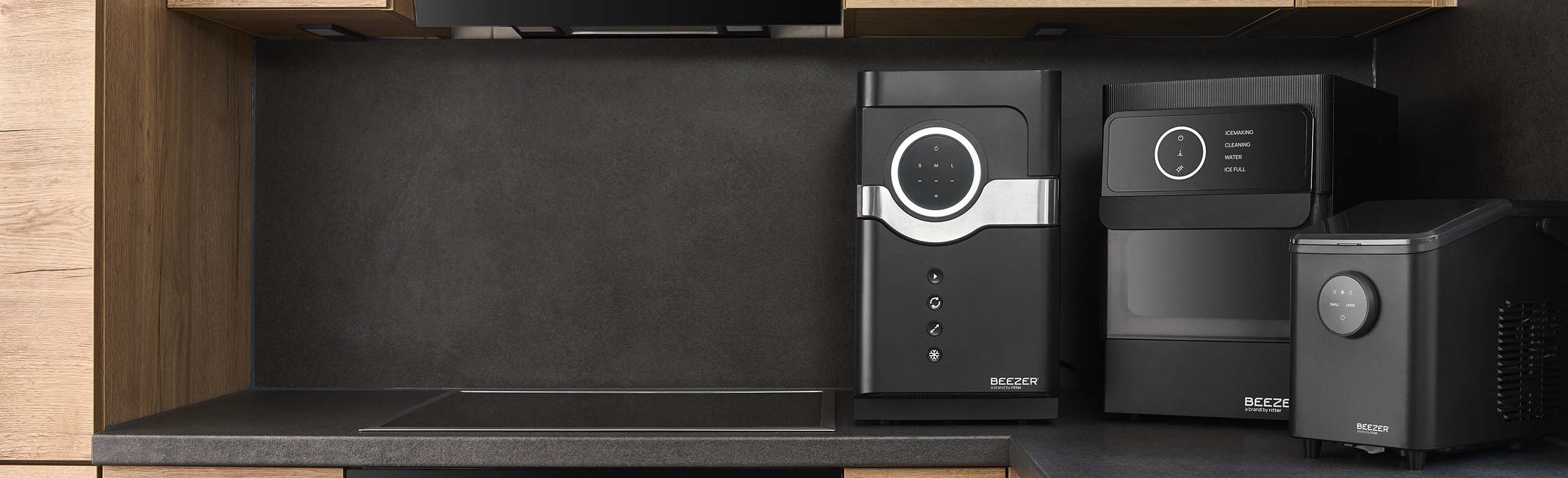 BEEZER Bottle Cooler, IceBall and IceCube mini in a beautifully designed dark kitchen